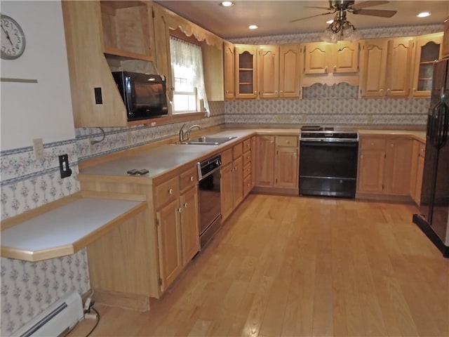 kitchen featuring backsplash, ceiling fan, black appliances, and sink