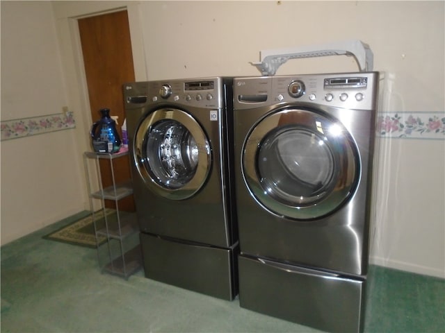 laundry area with carpet and washer and dryer