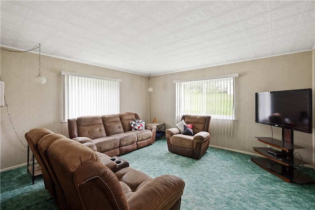 living room with dark carpet and ornamental molding