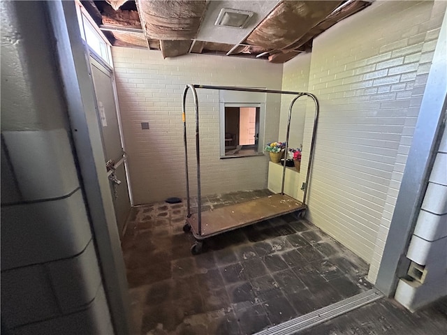 interior space featuring dark tile flooring