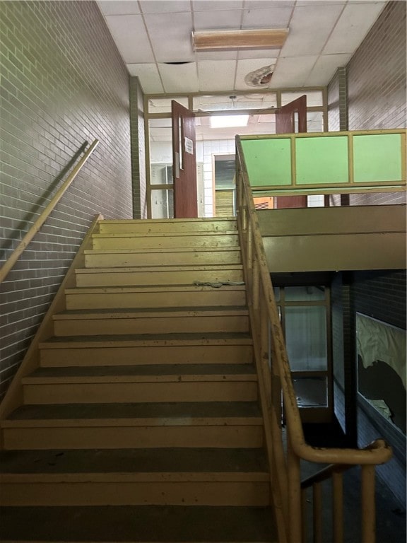 stairway with a drop ceiling