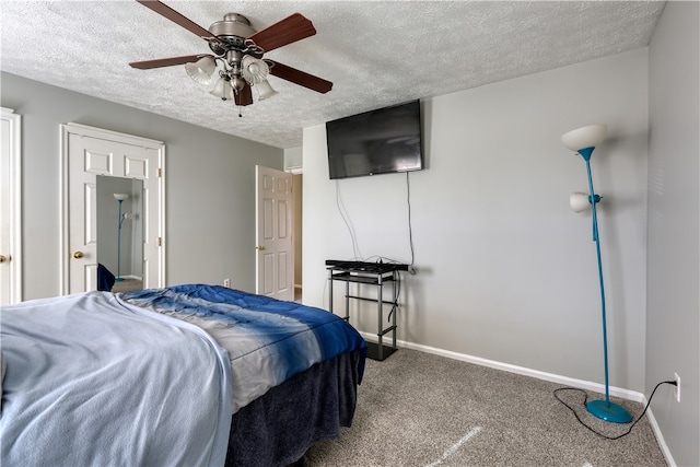 carpeted bedroom with ceiling fan and a textured ceiling