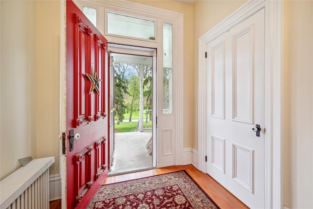 foyer with light hardwood / wood-style floors