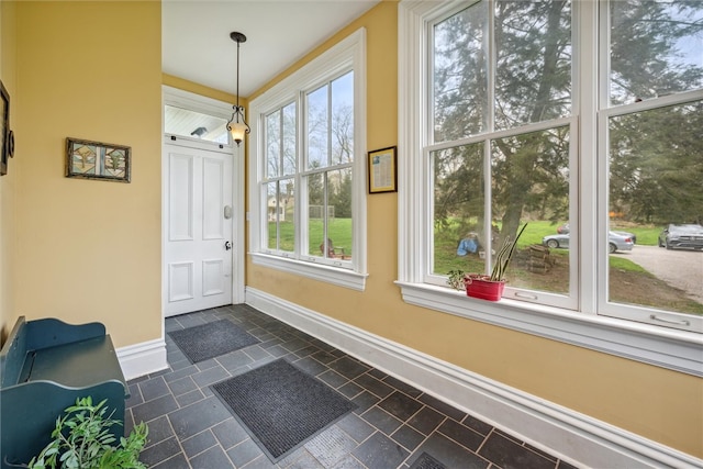 tiled entryway featuring plenty of natural light