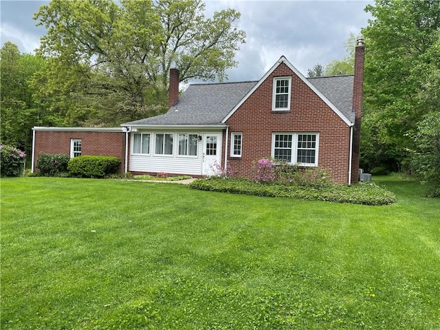 back of house featuring a yard