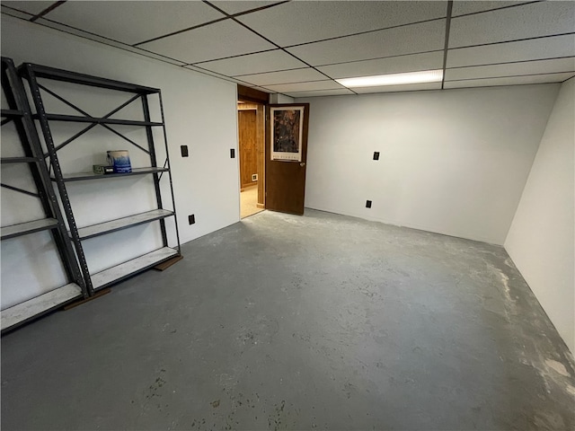 basement featuring a paneled ceiling