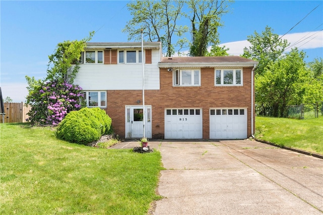 view of front of home featuring a garage and a front yard