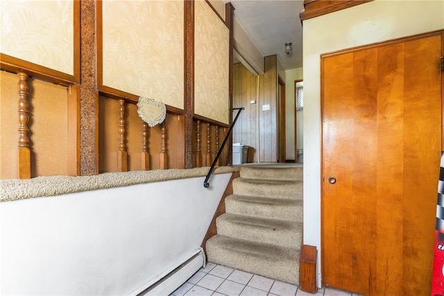 staircase featuring light tile flooring