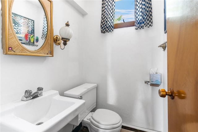 bathroom featuring sink and toilet