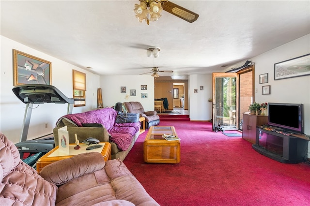 living room with ceiling fan and carpet flooring