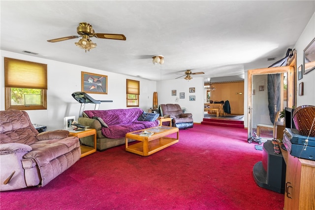 living room with ceiling fan and carpet