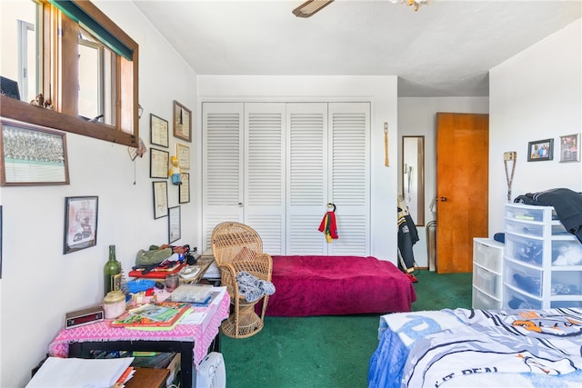 bedroom featuring a closet, carpet floors, and ceiling fan