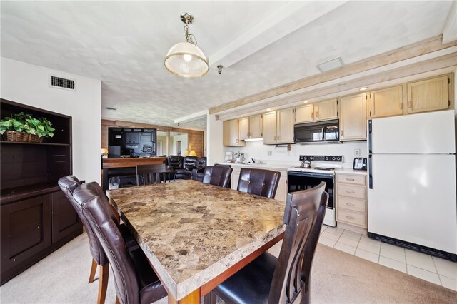 view of carpeted dining space