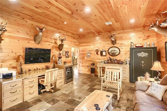 living room with wooden walls, tile flooring, and wooden ceiling