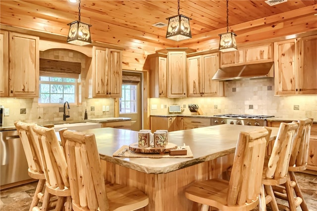 kitchen featuring a breakfast bar, light brown cabinetry, backsplash, wood ceiling, and hanging light fixtures