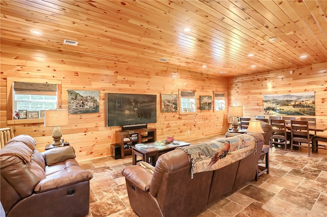 living room with wooden walls, tile floors, and wood ceiling