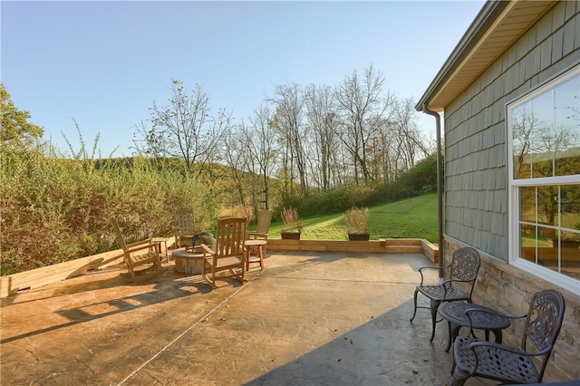 view of patio with a fire pit