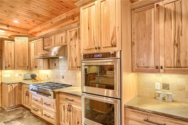 kitchen featuring stainless steel appliances, tile flooring, tasteful backsplash, wood ceiling, and light brown cabinetry