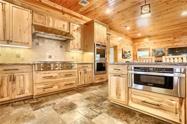 kitchen with tile floors, wooden ceiling, light brown cabinetry, appliances with stainless steel finishes, and light stone counters