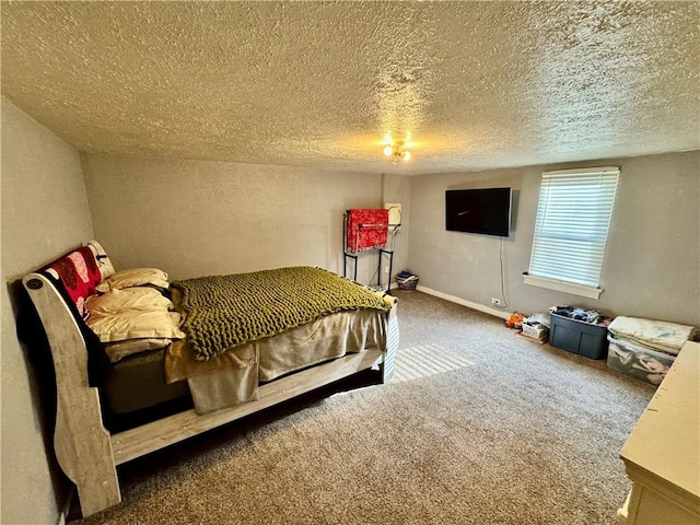 bedroom featuring dark carpet and a textured ceiling