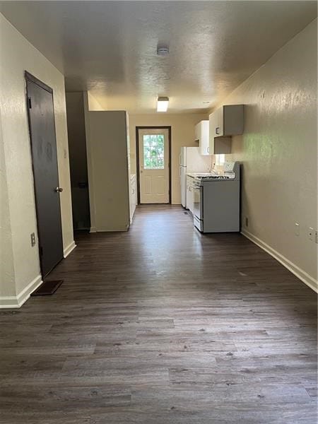 unfurnished living room with wood-type flooring