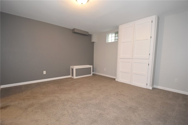 empty room featuring dark colored carpet