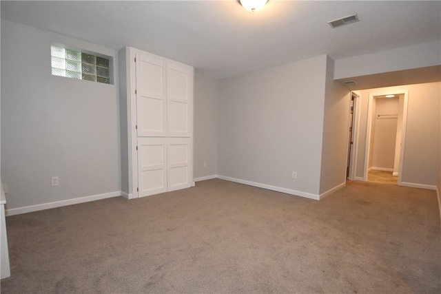 spare room featuring carpet floors