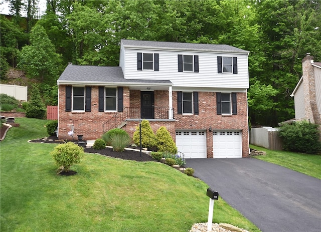 view of front facade featuring a garage and a front lawn