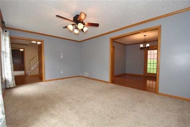 spare room with wood-type flooring, crown molding, and ceiling fan with notable chandelier