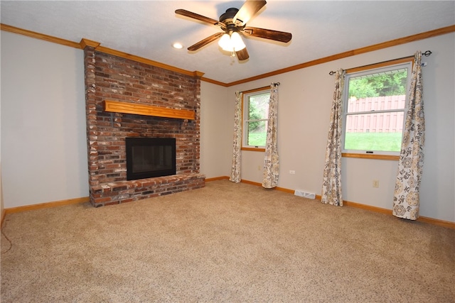 unfurnished living room with brick wall, ceiling fan, a brick fireplace, and carpet floors