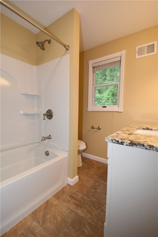 full bathroom with tile flooring,  shower combination, vanity, and toilet