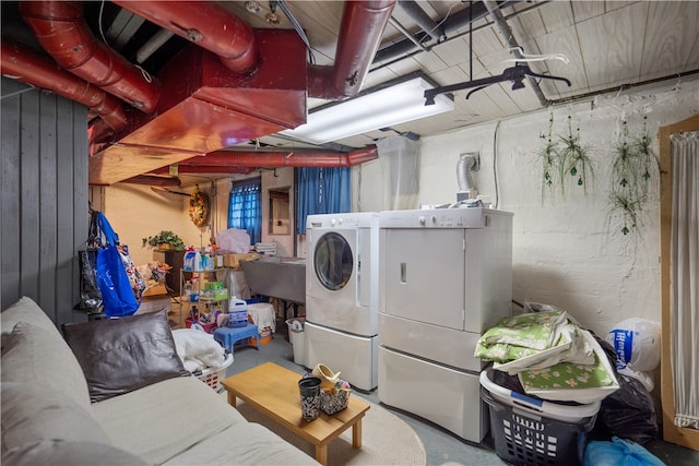 clothes washing area featuring washing machine and clothes dryer