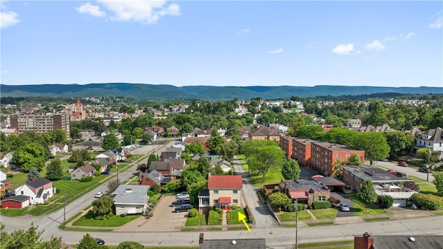 birds eye view of property with a mountain view