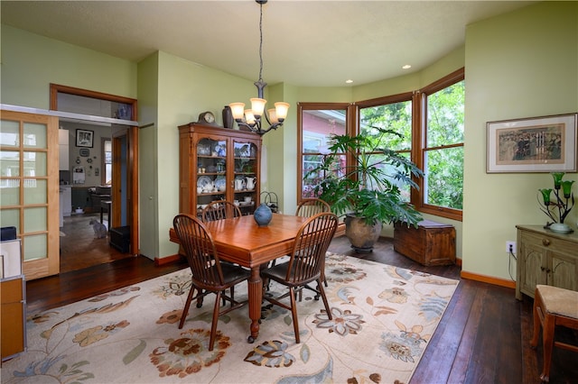 dining area featuring a chandelier and hardwood / wood-style floors