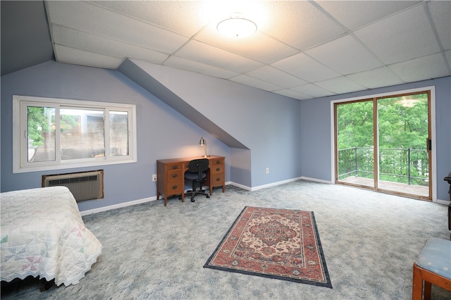 bedroom featuring access to exterior, carpet, and a paneled ceiling