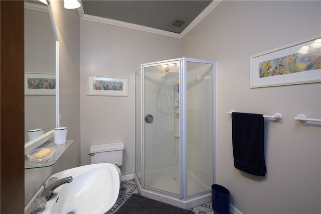 bathroom with a shower with shower door, crown molding, toilet, tile flooring, and sink