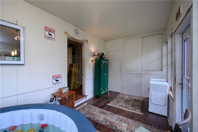 bedroom with dark wood-type flooring