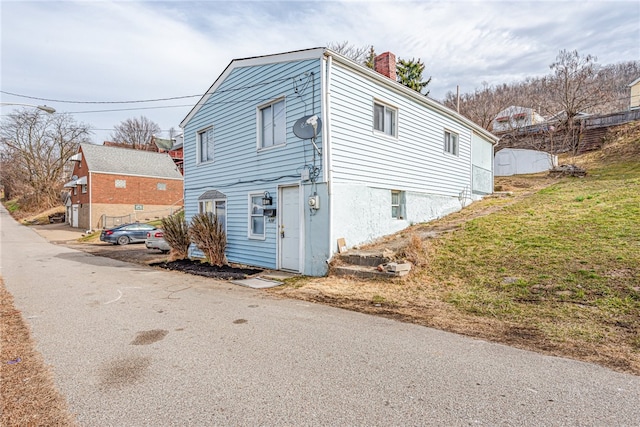 view of side of property featuring a garage