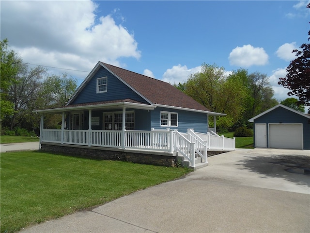 country-style home featuring a garage, a front lawn, a porch, and an outbuilding