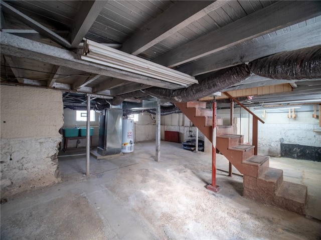 basement with heating unit and water heater