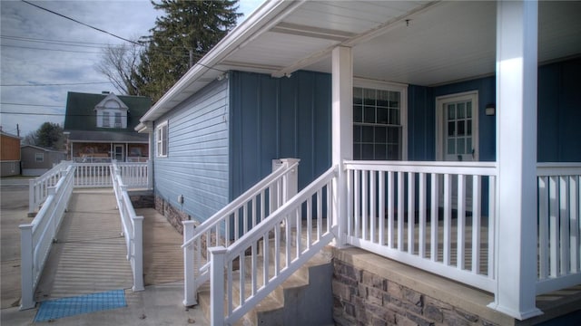 view of exterior entry with a porch