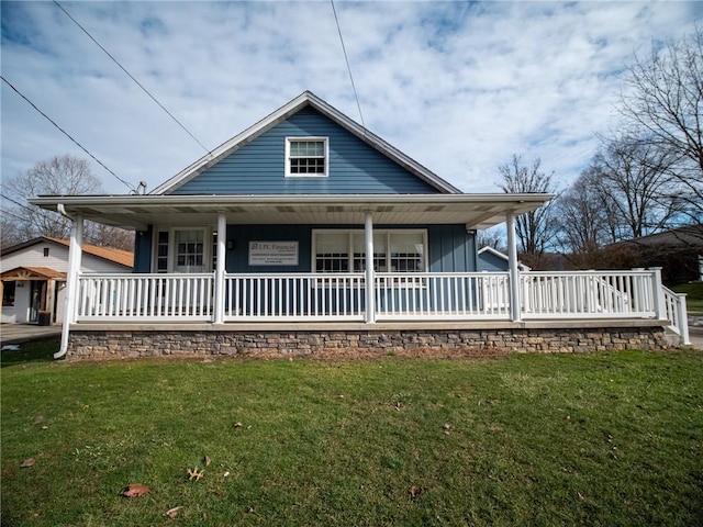 view of front of property with a front lawn and a porch