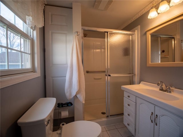 bathroom with walk in shower, tile patterned floors, vanity, and toilet