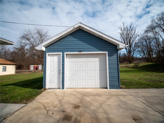 garage with a lawn