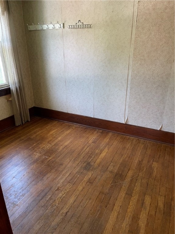 unfurnished room with hardwood / wood-style floors