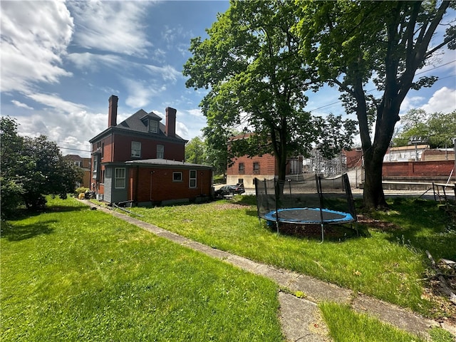 view of yard featuring a trampoline