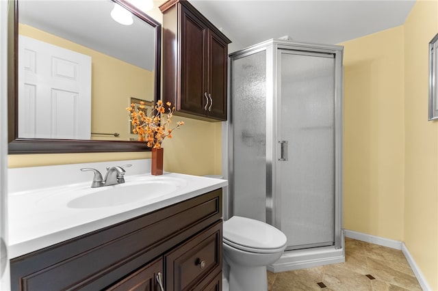 bathroom featuring tile flooring, walk in shower, vanity, and toilet