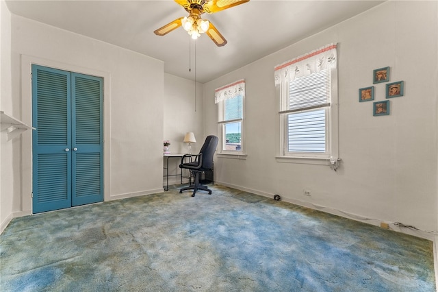 interior space featuring ceiling fan and carpet floors