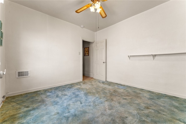 carpeted empty room featuring ceiling fan