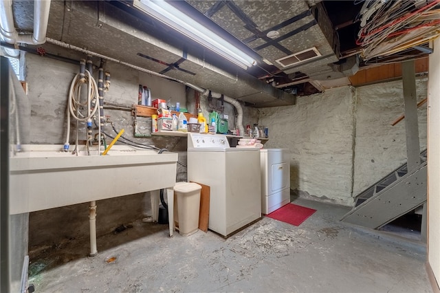 basement featuring washing machine and dryer